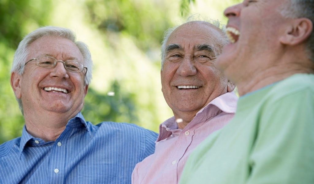 Illustrative home-care scene with a care professional and family